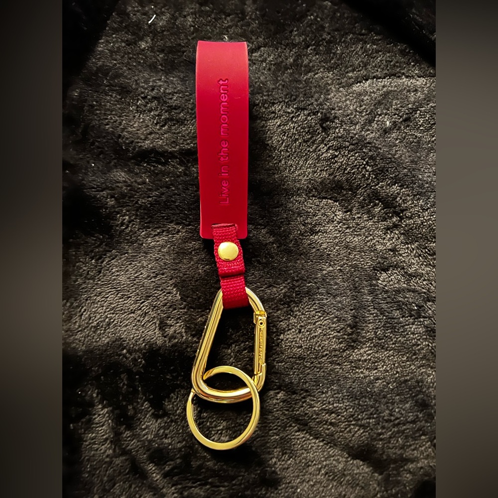 Lululemon pink and gold silicone keychain